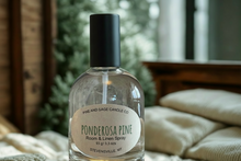 Load image into Gallery viewer, Ponderosa Pine room and linen spray bottle with a label on a blurred background
